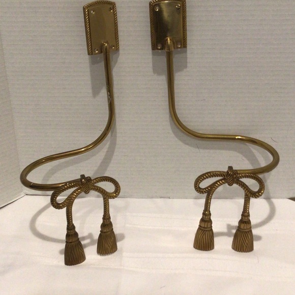 A pair of vintage brass tasseled bow motif curtain tie backs/holdbacks